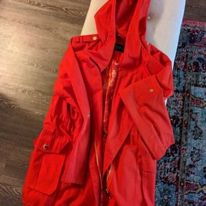 Orange Guess Raincoat with drawcord bottom, front snap pockets, gold hardware